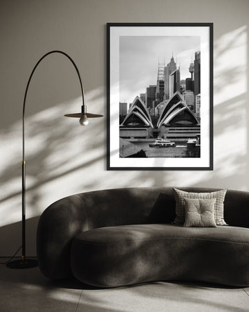 Framed Sydney Opera House fine art print overlooking Sydney Harbour, displayed in a modern Australian interior.