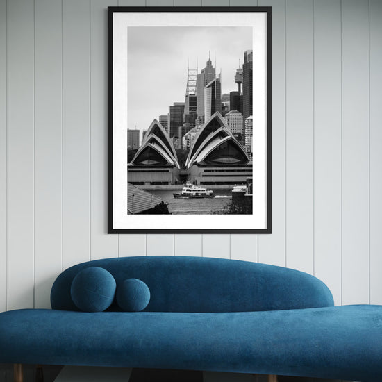 Framed Sydney Opera House fine art print overlooking Sydney Harbour, displayed in a modern Australian interior.